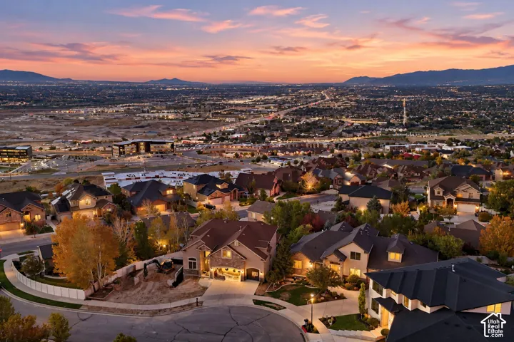 Expansive neighborhood with scattered mature trees and diverse architectural styles