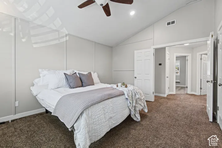 Vaulted ceiling with a ceiling fan, recessed lighting, and panel accent wall