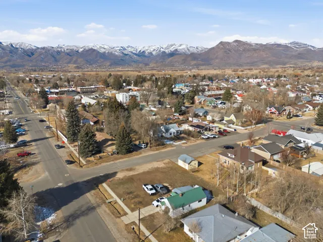 Neighborhood setting with established residential properties and prominent mountainous backdrop