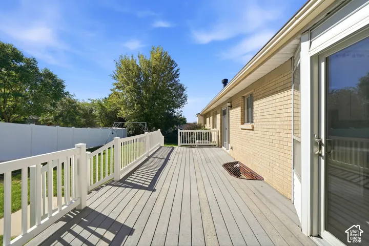 Expansive outdoor deck with composite decking and white railings