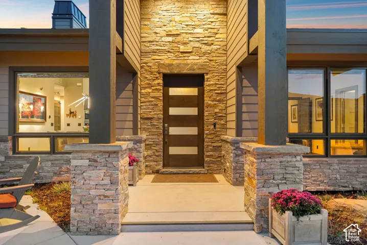 Stone veneer facade with wood siding accents