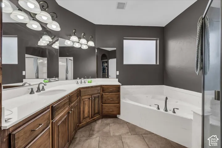 Dual vanity with wood cabinetry and undermount sinks