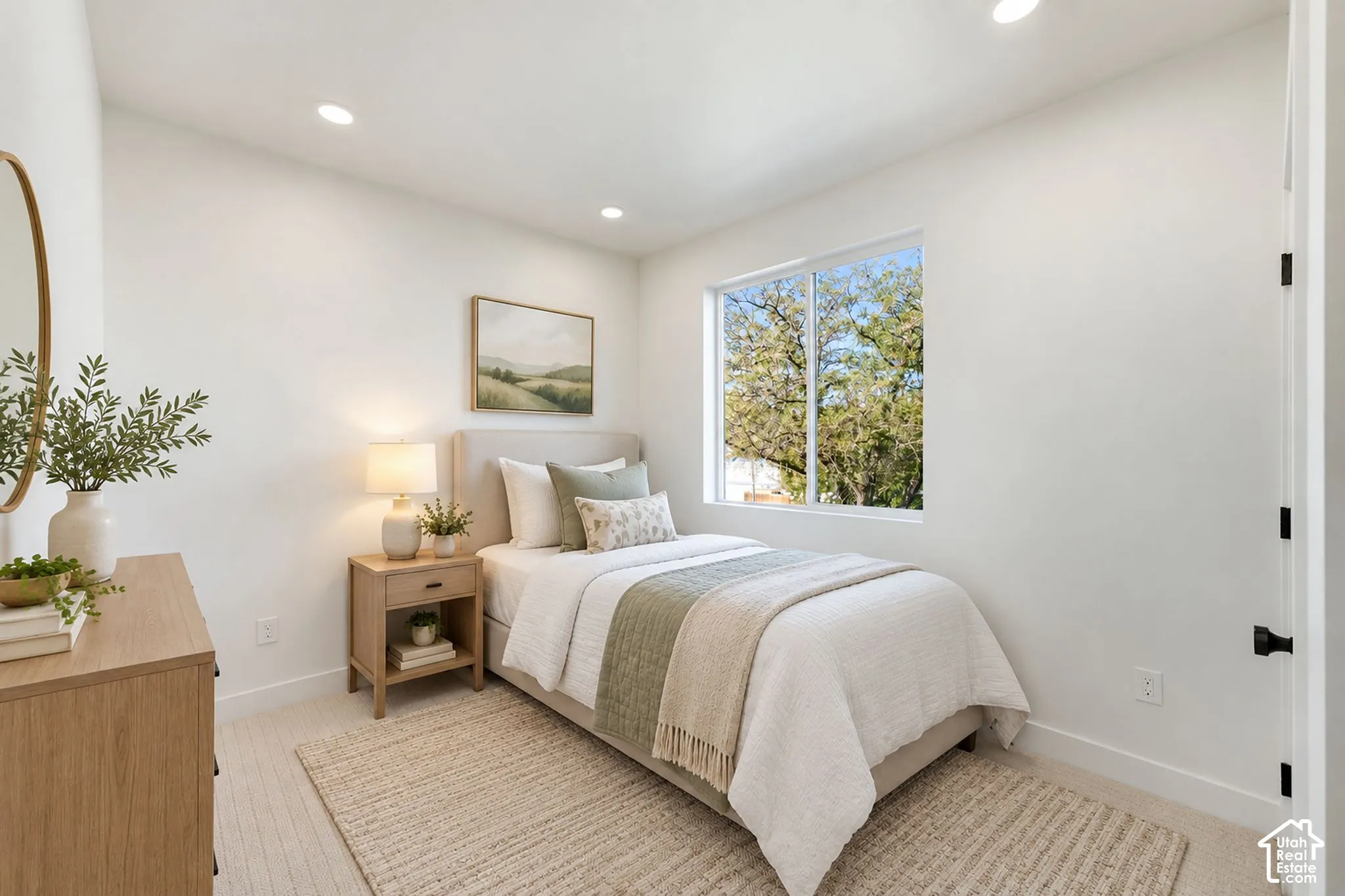 Recessed lighting, carpet, and a window with white trim