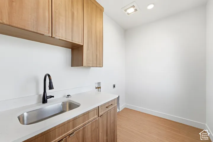 LVPflooring, white walls, and recessed lighting