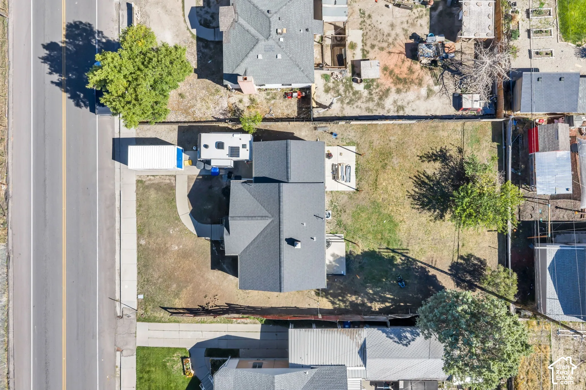 Newly installed dark shingle roof with a central chimney