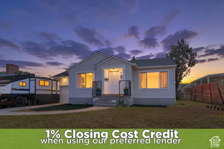 Siding exterior with a covered entry, white front door, and an attached garage