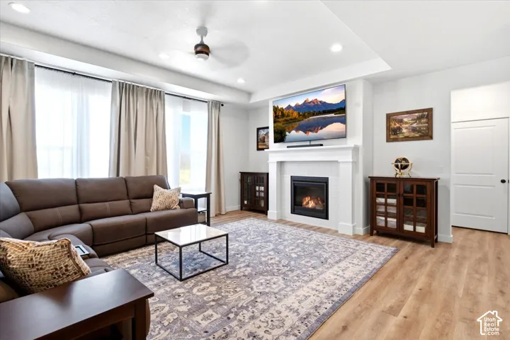 10 ft tray ceiling, ceiling fan, gas fireplace and abundant light in great room
