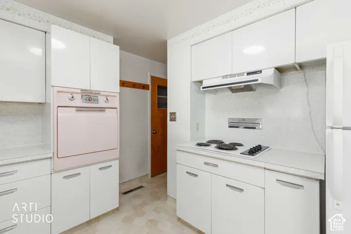White cabinetry with sleek hardware