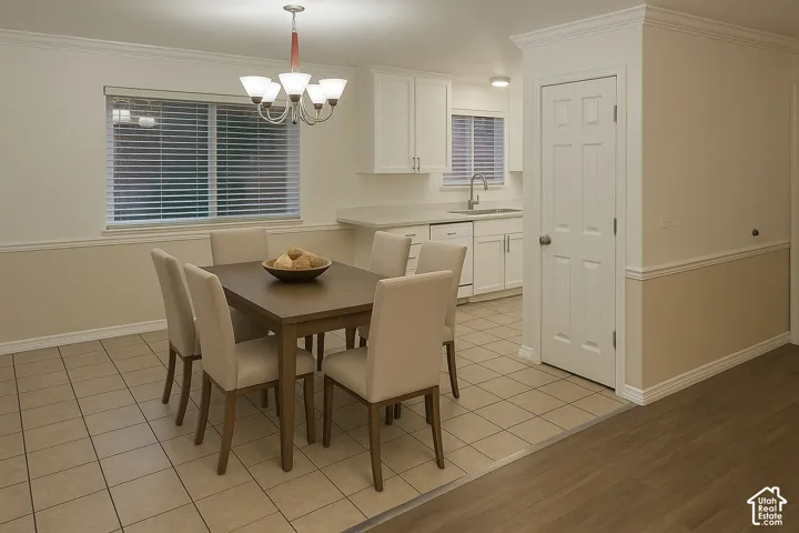 Open concept dining area featuring a chandelier, tile flooring, and a window with blinds