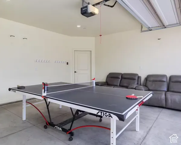 Finished garage space featuring a concrete floor and recessed ceiling lighting