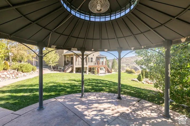 Gazebo with concrete flooring and overhead lighting