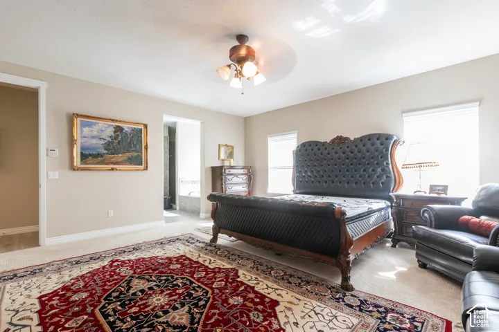 Recessed lighting, ceiling fan, and carpeted flooring