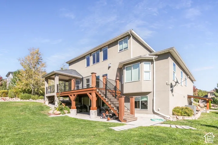 Expansive backyard with a multi-level deck and covered patio