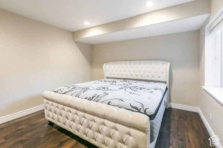 Recessed lighting, wood-finish flooring, and neutral wall tones