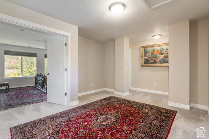 Recessed lighting, light-toned carpeting, ample natural light, paneled interior doors, and neutral wall finishes