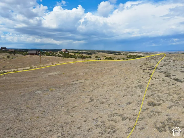 Expansive undeveloped land featuring natural vegetation and rolling terrain