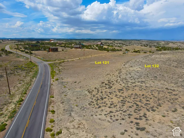 Expansive undeveloped land parcels with visible lot markers