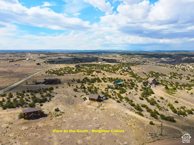 Expansive rural landscape featuring scattered residences and natural vegetation