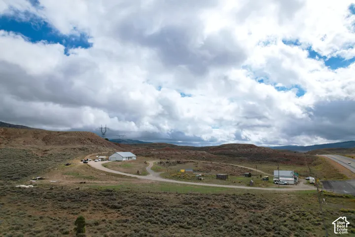 Expansive property featuring multiple structures and open land