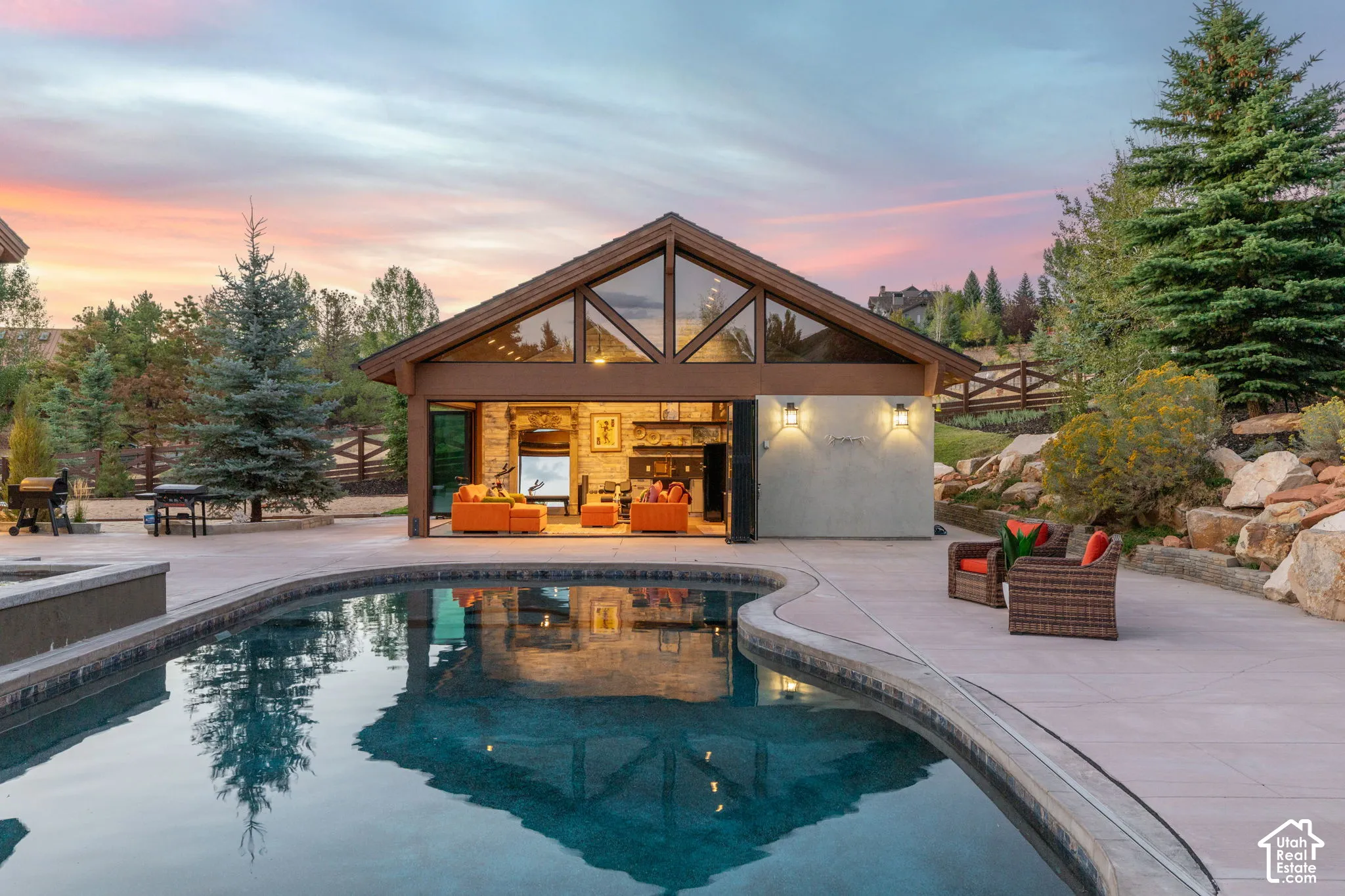 Outdoor pool featuring a curved edge and integrated spa