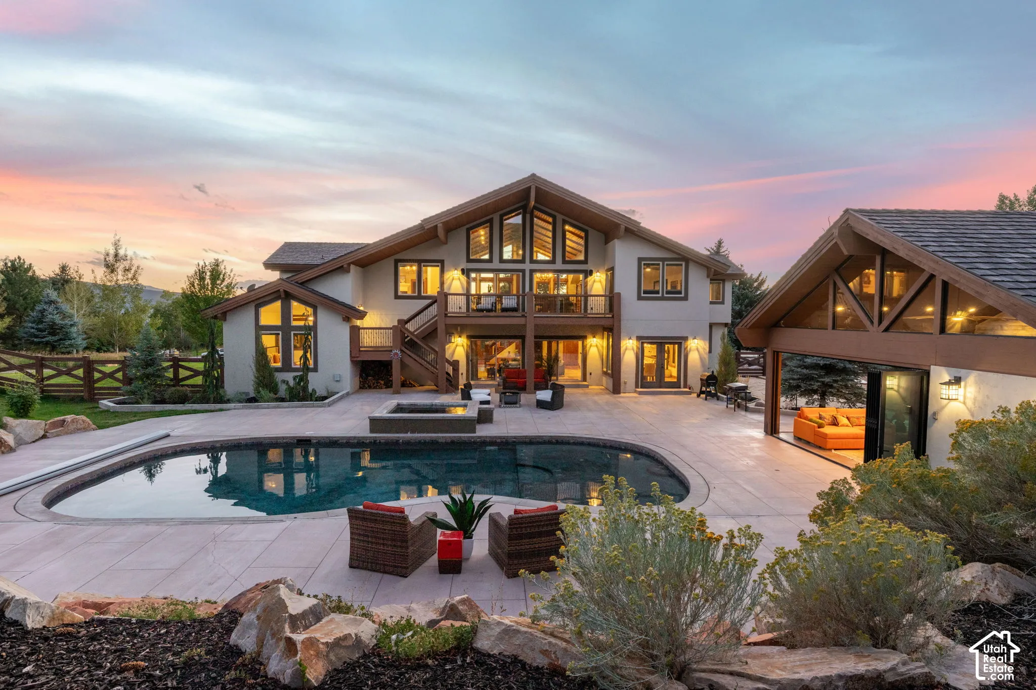Expansive patio featuring a built-in pool, integrated spa, and outdoor living area