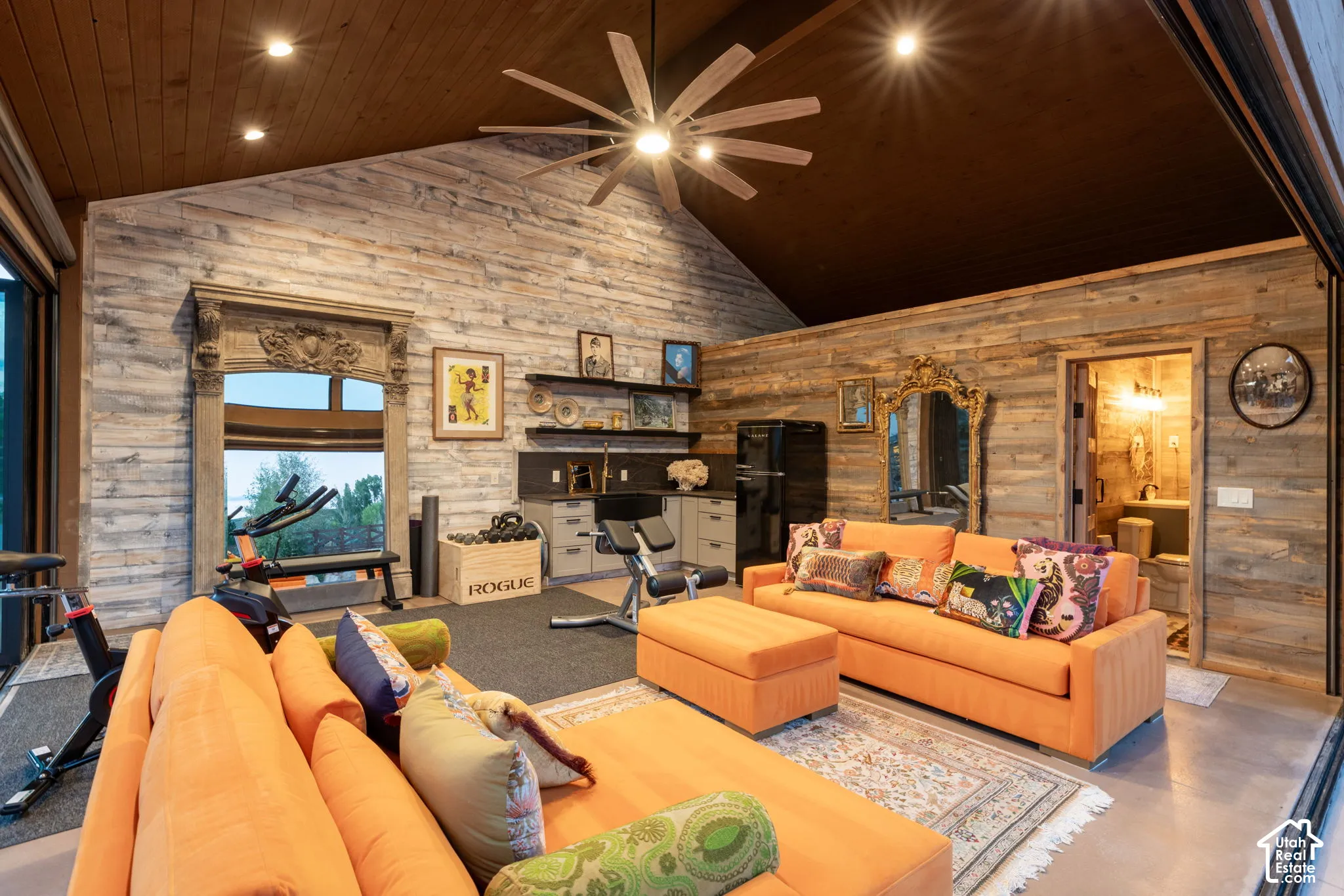 Vaulted wood-paneled ceiling with recessed lighting