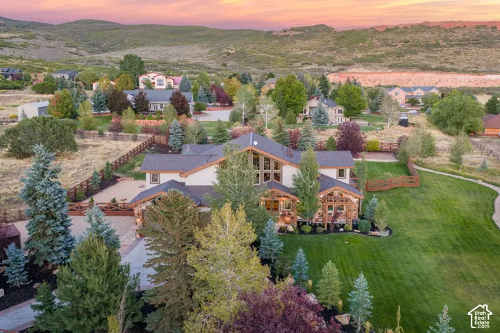 Expansive landscaped grounds with mature trees