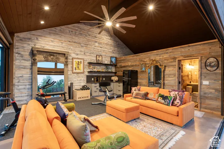 Vaulted wood-paneled ceiling with recessed lighting