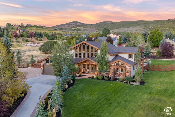 Stone and stucco exterior with exposed timber accents