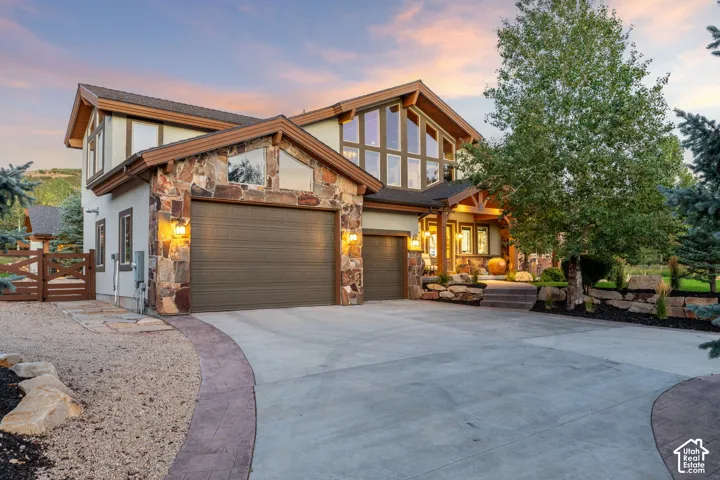 Stone and stucco exterior with exposed wood structural elements