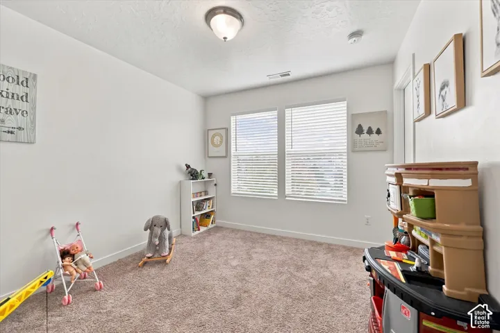 Plush carpet flooring complements bright white walls