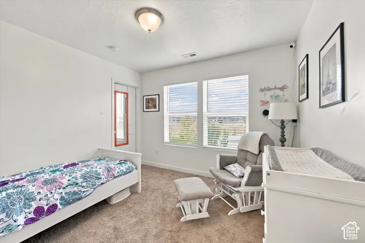 Wall-to-wall carpeting and white walls