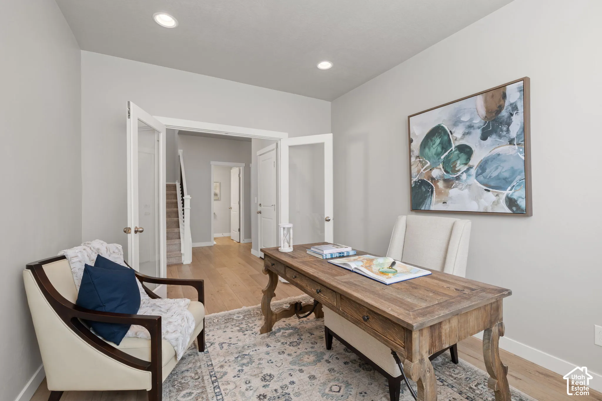 Recessed lighting, wood-finish flooring, and French doors