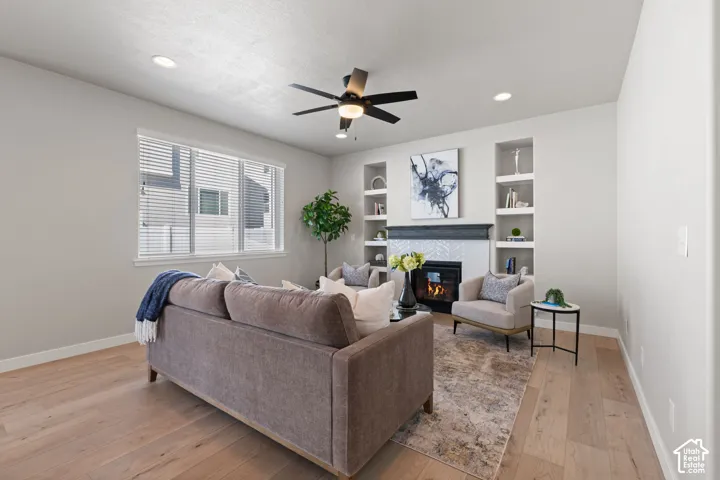 Recessed lighting, light wood-finish flooring, and a ceiling fan