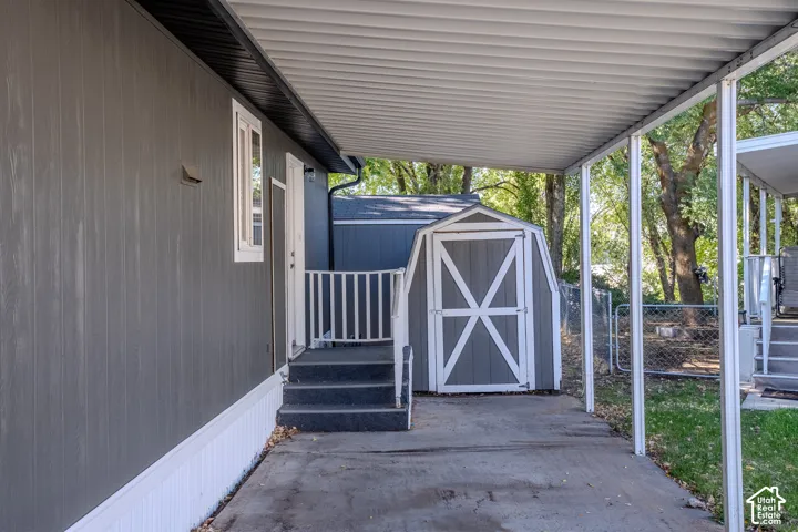 Gray vertical siding exterior with white trim