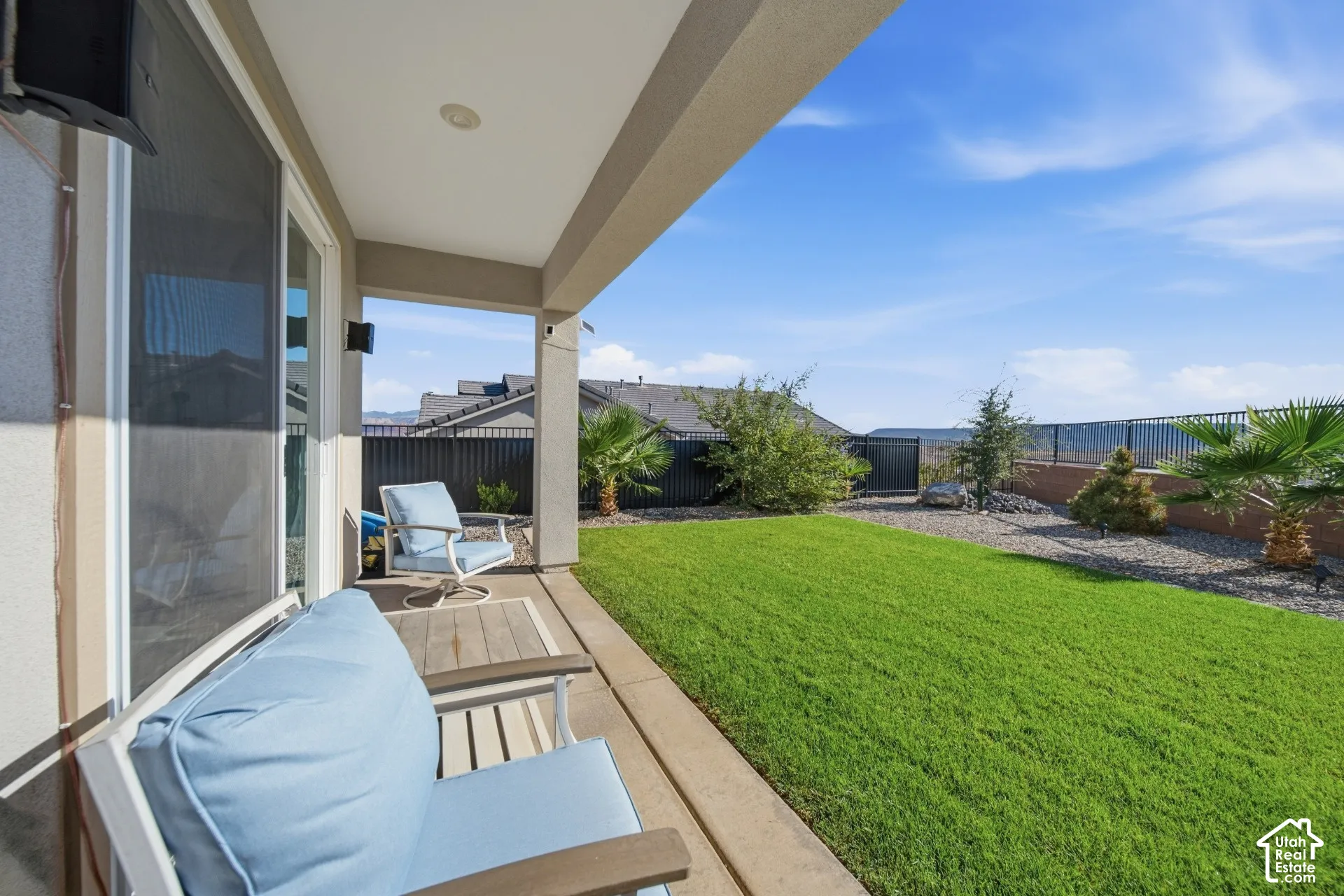 Covered patio with integrated lighting and sliding glass door access