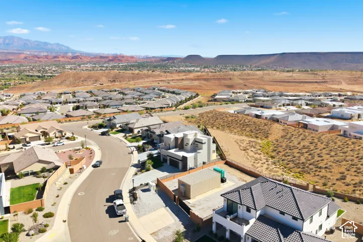 Expansive residential development with contemporary and traditional architectural styles, featuring a paved cul-de-sac