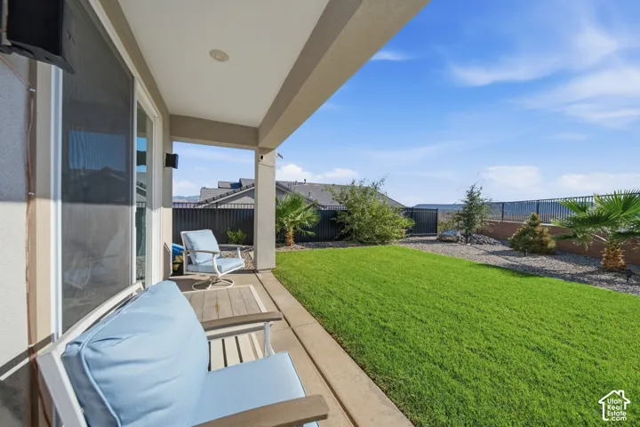 Covered patio with integrated lighting and sliding glass door access