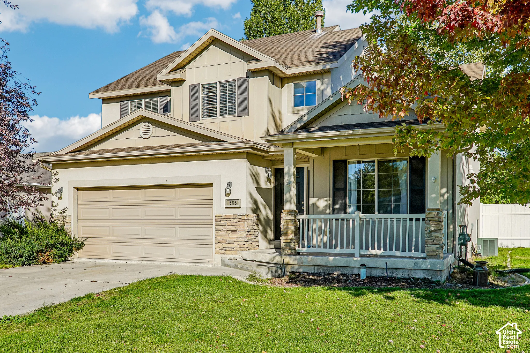 Two-story exterior with horizontal siding and stone accents