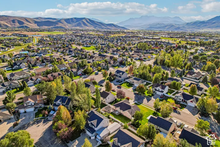 Residential community with established landscaping and mountain backdrop