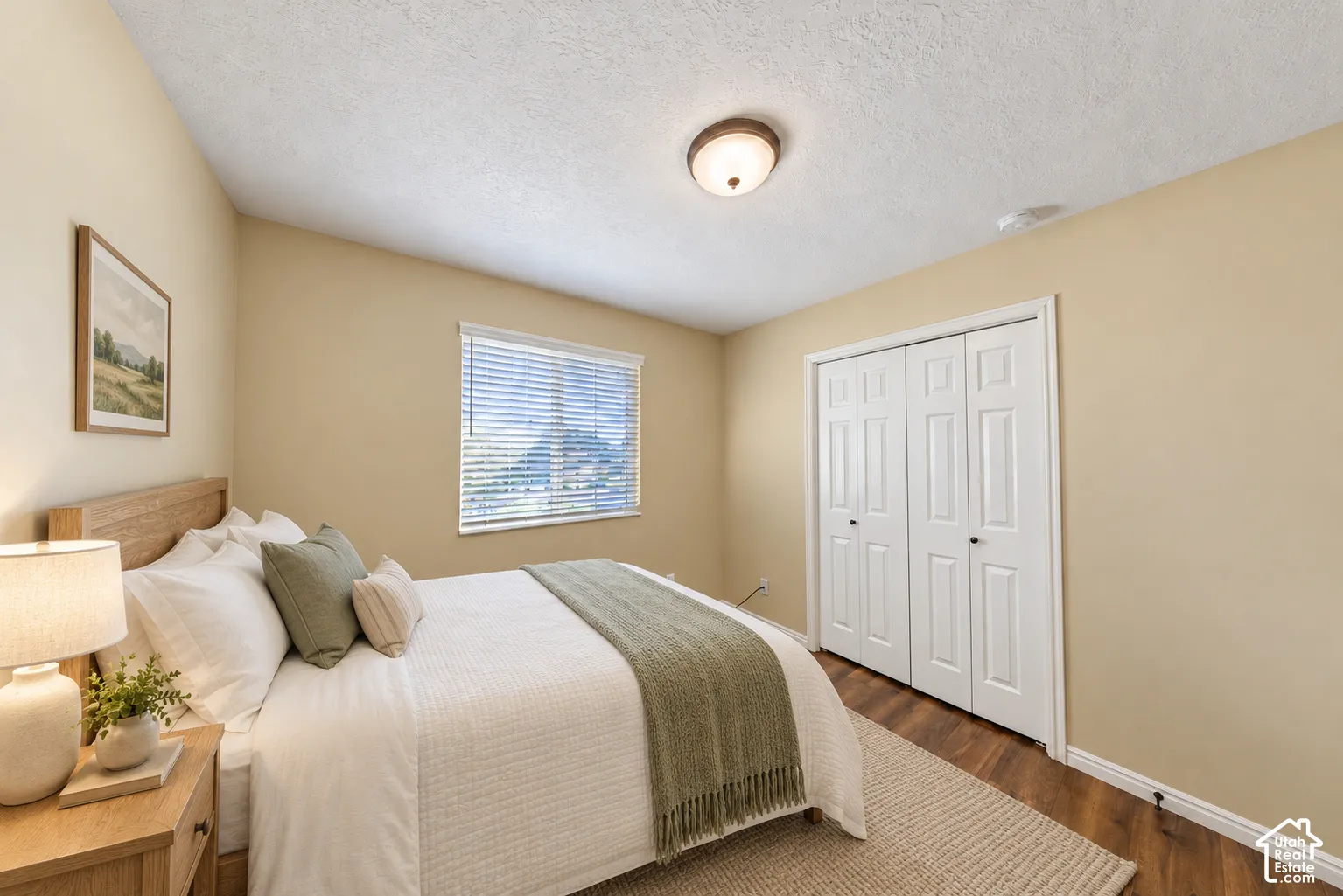Warmly painted walls with a window featuring blinds