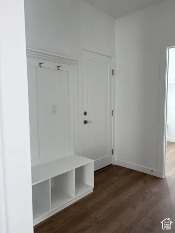 Built-in mudroom bench with cubby storage and coat hooks