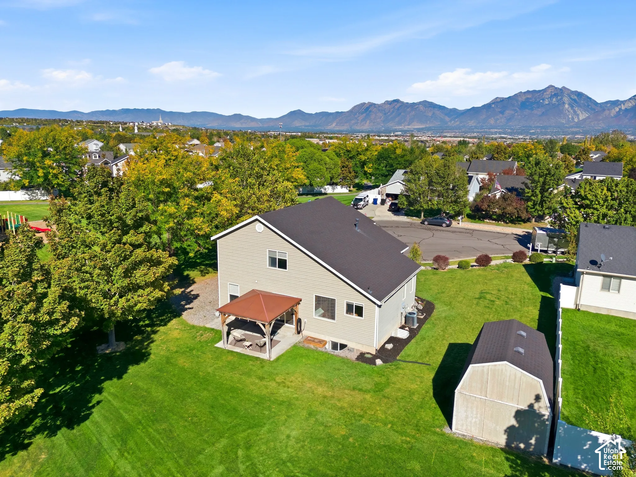 Expansive green lawn with mountain backdrop