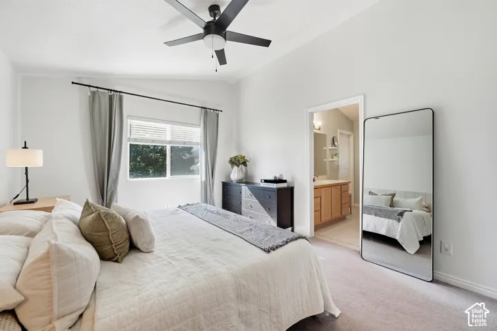 Vaulted ceiling, ceiling fan, window with blinds, wood-finish flooring, and recessed lighting