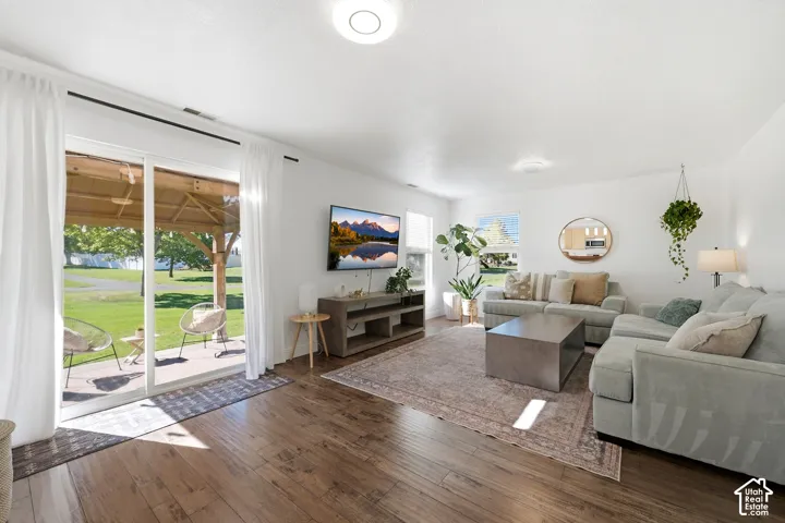 Wood-finish flooring throughout, bright white walls, and a recessed ceiling light