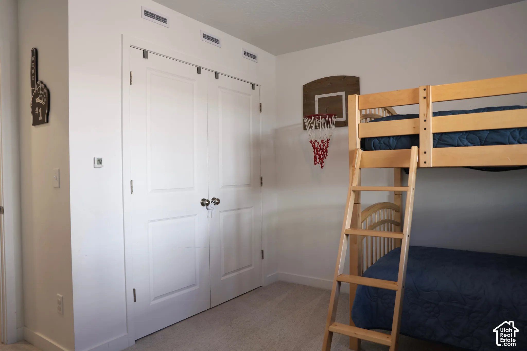 White paneled closet doors with polished chrome hardware