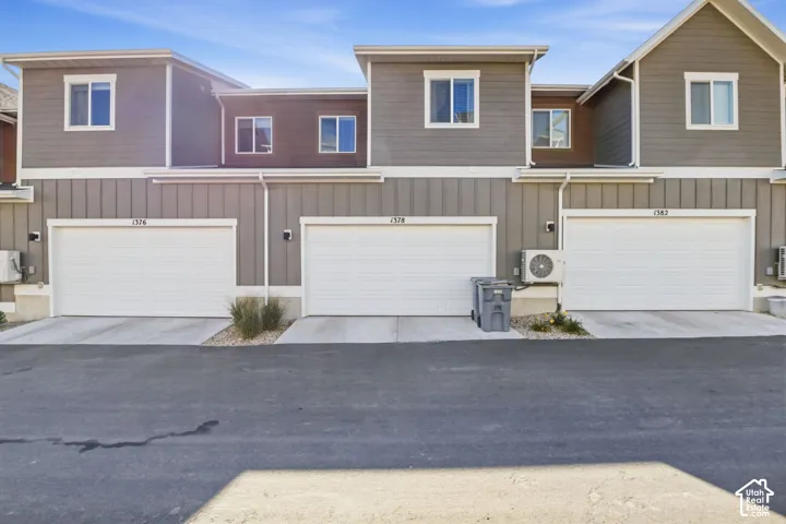 Modern multi-story facade featuring horizontal and vertical siding