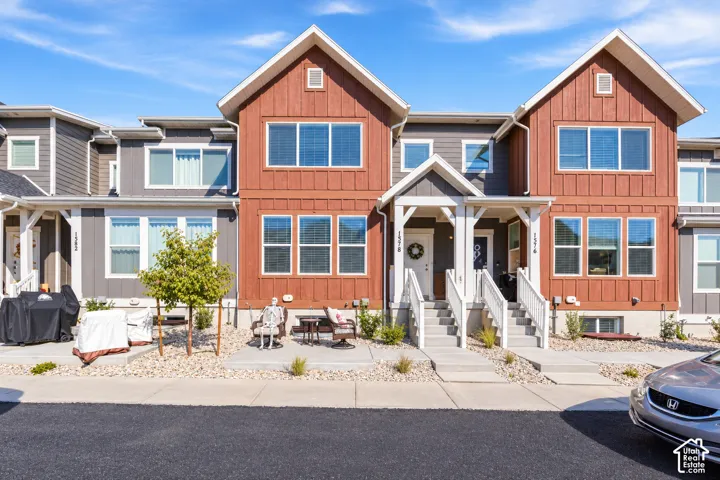 Contemporary multi-story townhome with a mixed material exterior