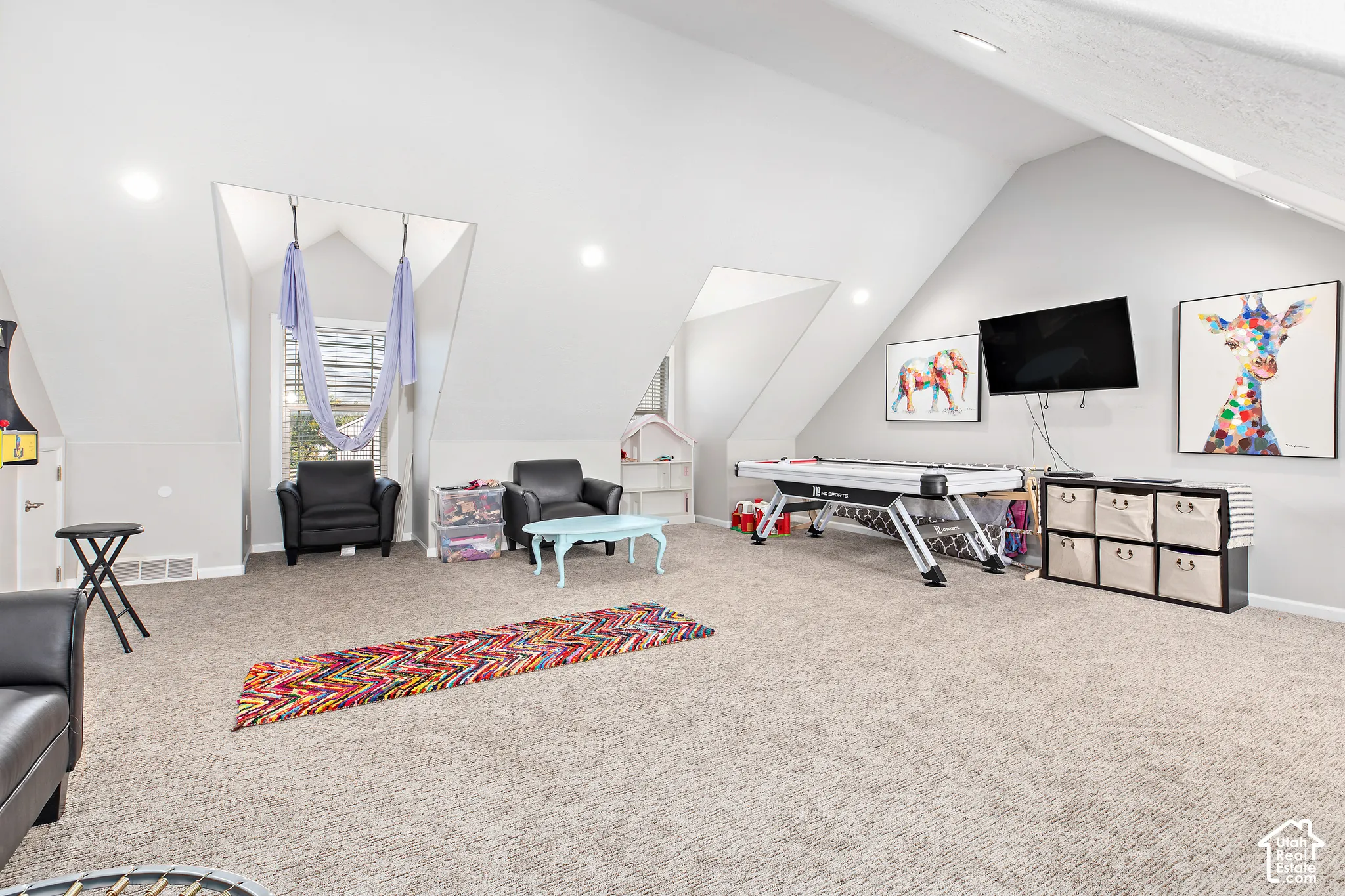 Spacious bonus room featuring dormer windows, recessed lighting, and sloped ceilings
