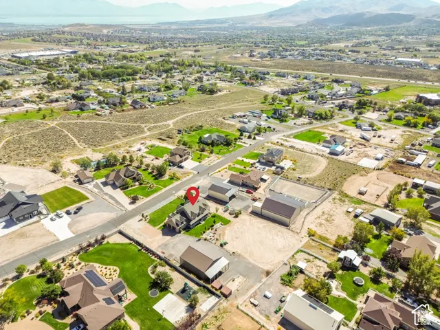 Expansive residential lot with a large detached garage structure
